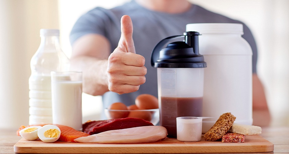 53578416 - sport, fitness, healthy lifestyle, diet and people concept - close up of man with food rich in protein showing thumbs up
