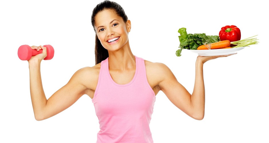 13303085 - portrait of a healthy woman with vegetables and dumbbells promoting a healthy fitness and eating lifestyle