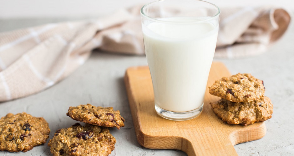 66109944 - breakfast: a glass of milk and homemade oatmeal cookies