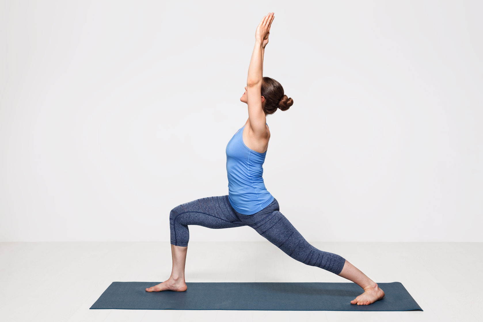 50988754 - beautiful sporty fit yogini woman practices yoga asana virabhadrasana 1 - warrior pose 1