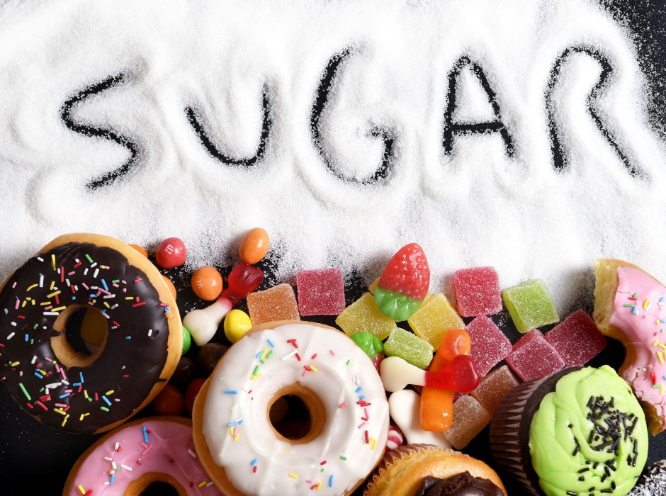 40972446 - mix of sweet cakes, donuts and candy with sugar spread and written text in unhealthy nutrition, chocolate abuse and addiction concept, body and dental care