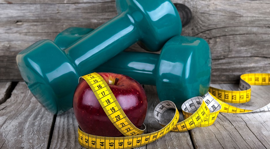 32340148 - measuring tape wrapped around a apple weight loss photo